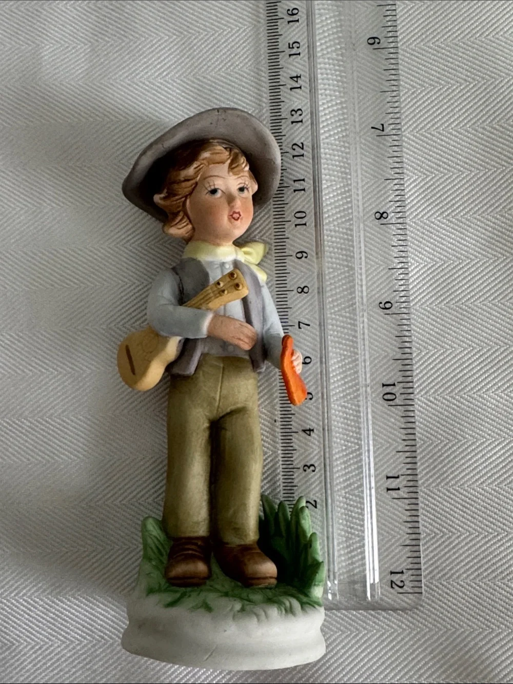 Hand-Painted Porcelain Boy Figurine in Neutral and Orange